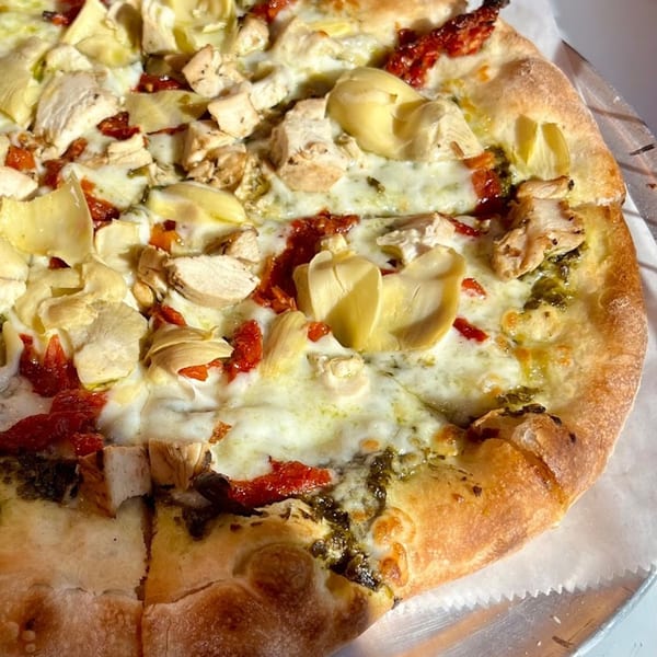Niki's Pizza & Pasta's chicken and artichoke pizza with sun-dried tomatoes and pesto.